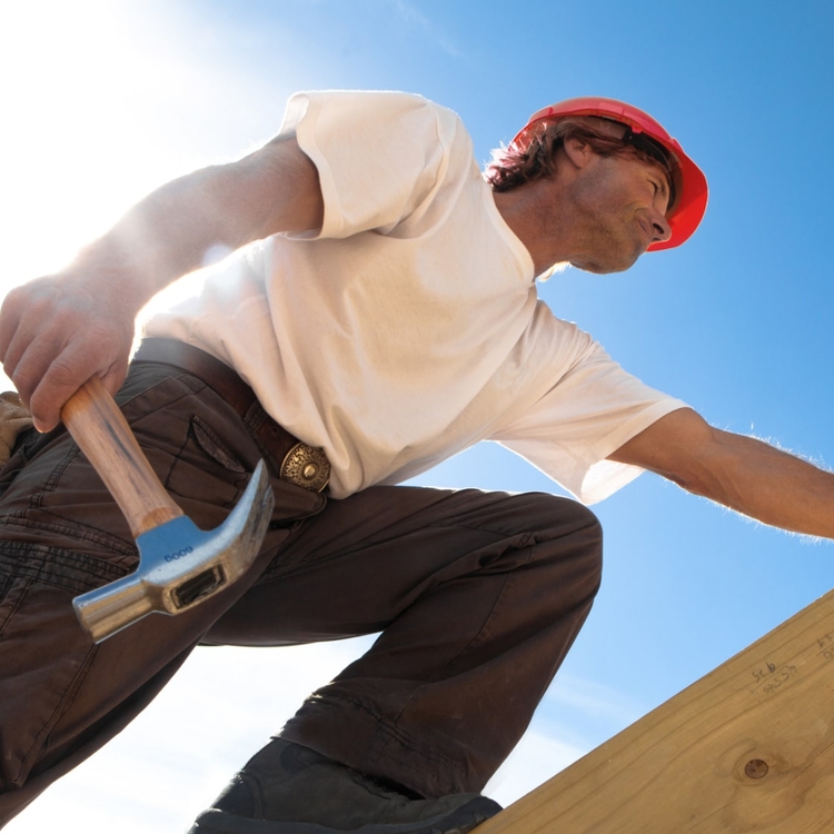 roofing professional climbing in the roof