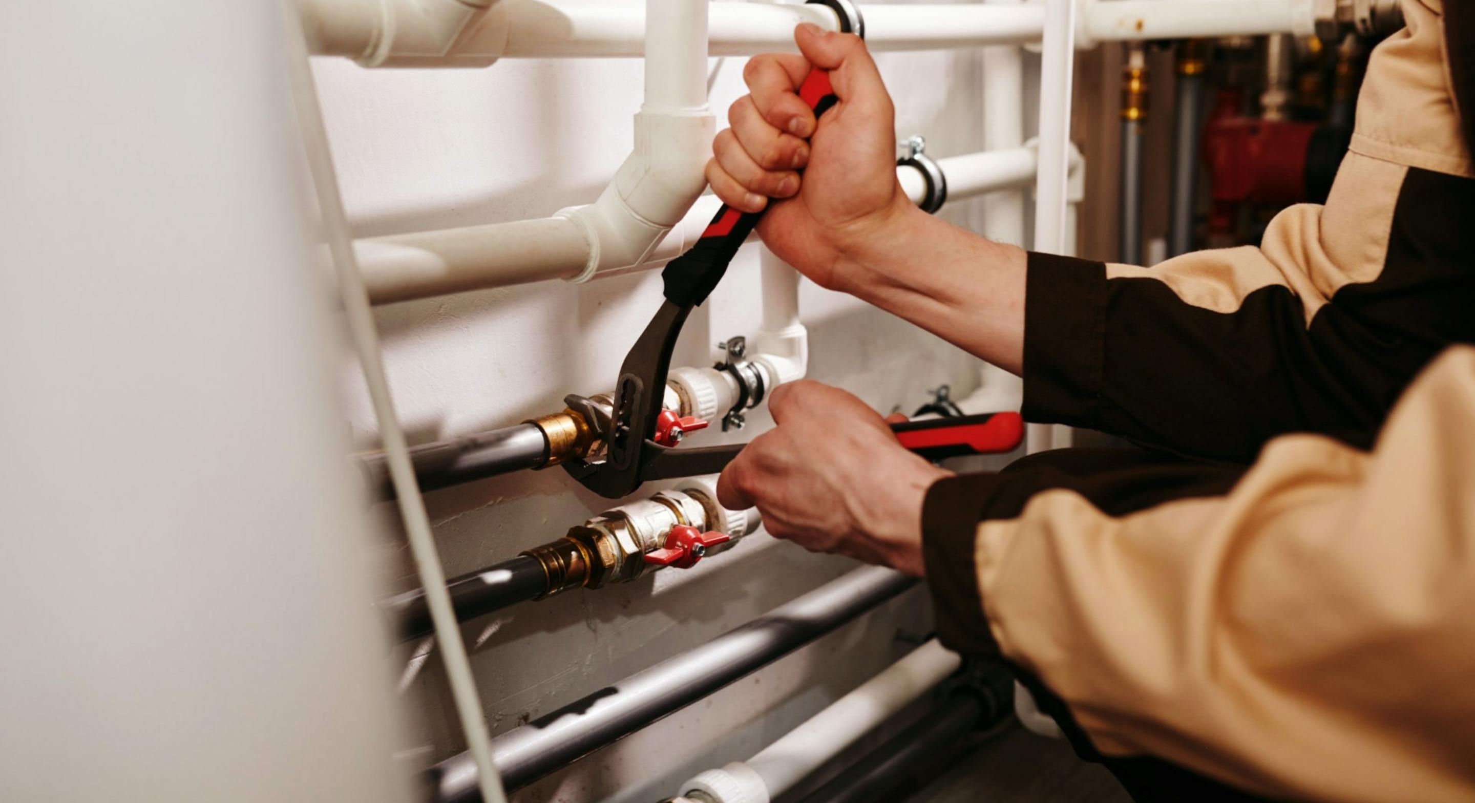 Plumber fixing the faulty pipeline