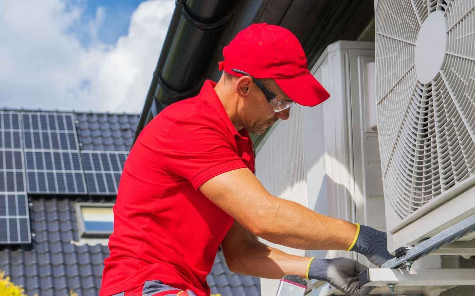 HVAC technician loading equipment