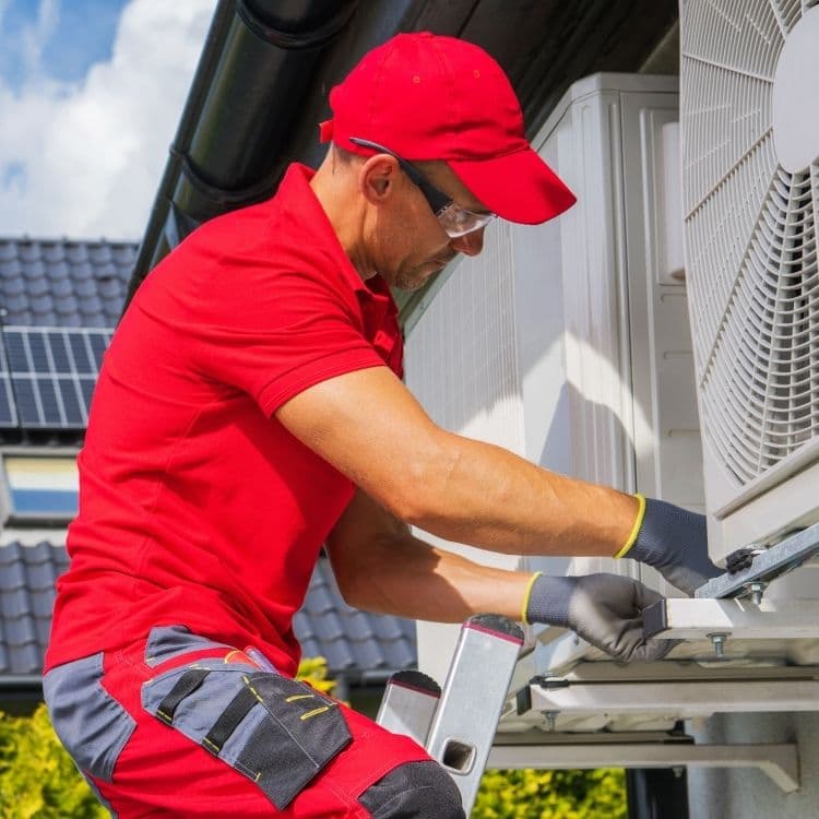 Hvac professional working on site | ServiceForge