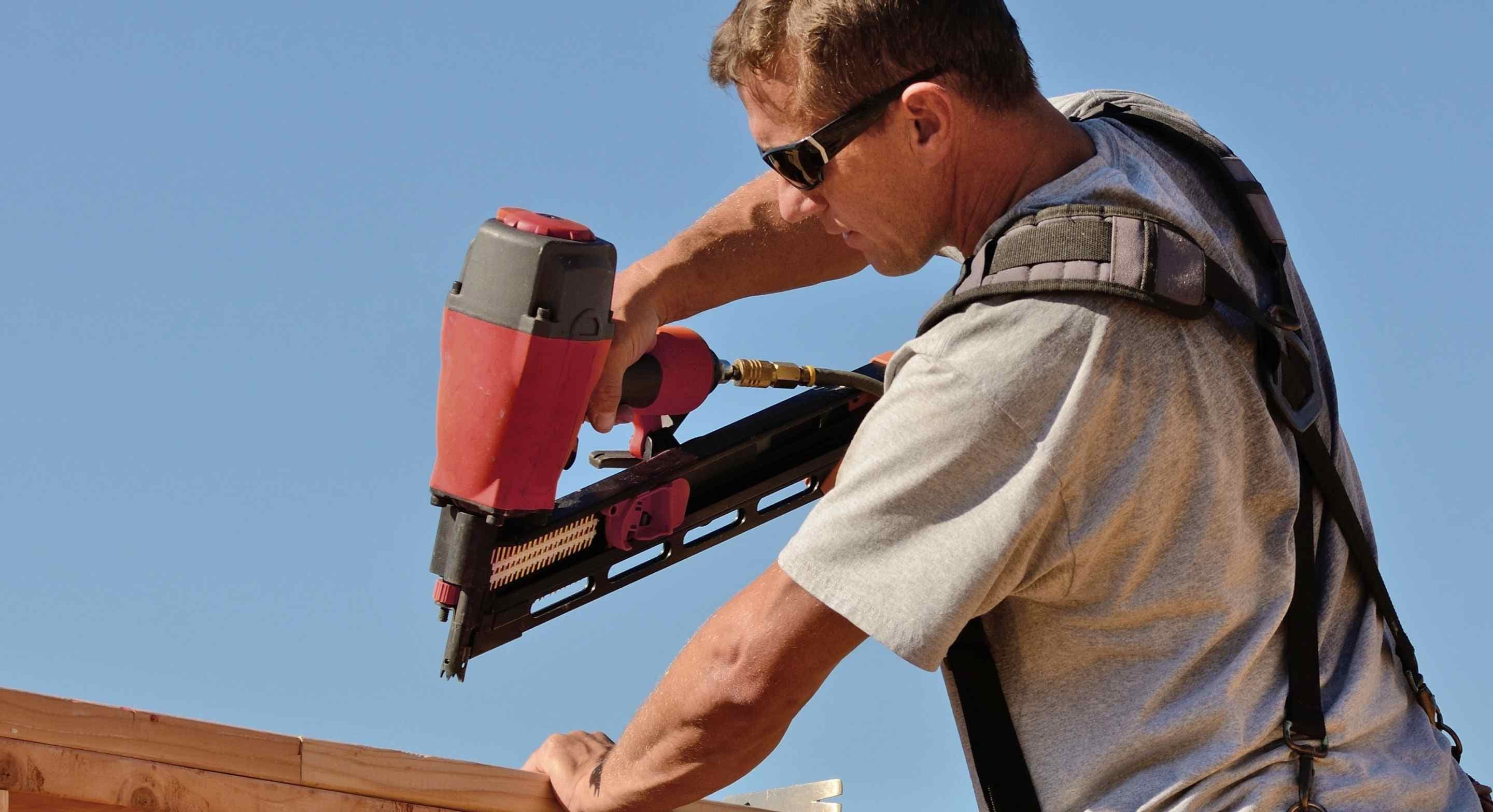 roofing professional climbing in the roof