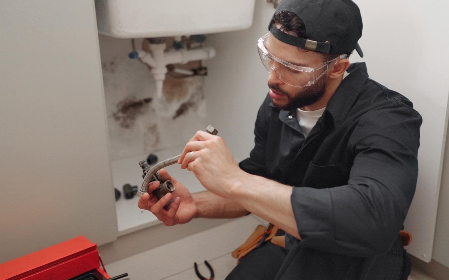 Plumber fixing the faulty pipeline